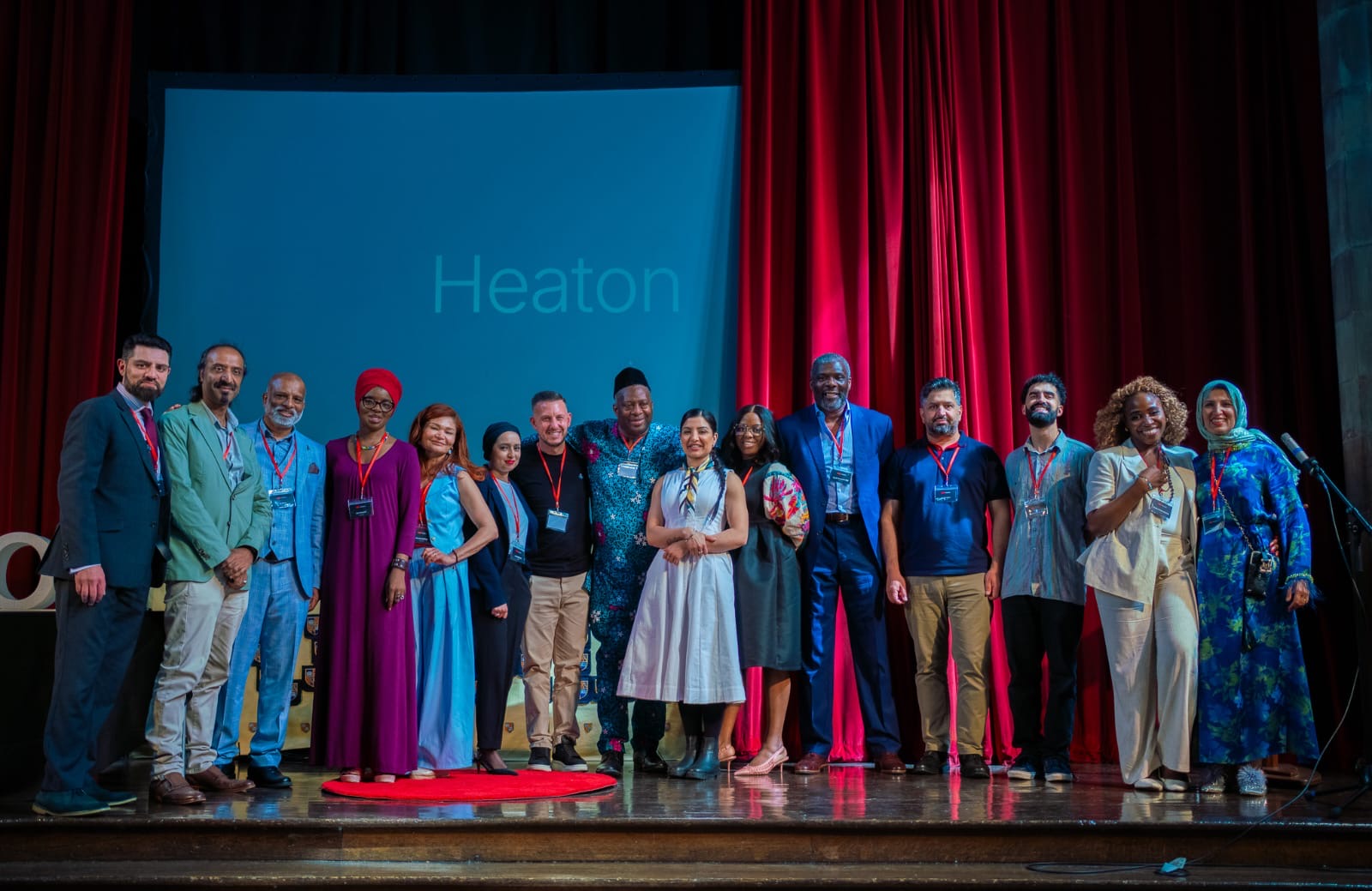 TEDxHeaton speaker group photo on stage